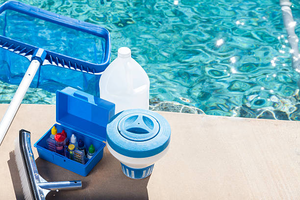 A table with some water bottles and other items on it